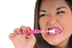 dental care concept with beautiful smilling young woman and tooth brush